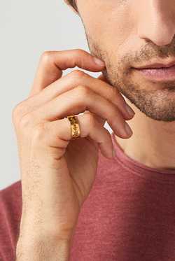 14 karat gold cut sound wave ring on male
